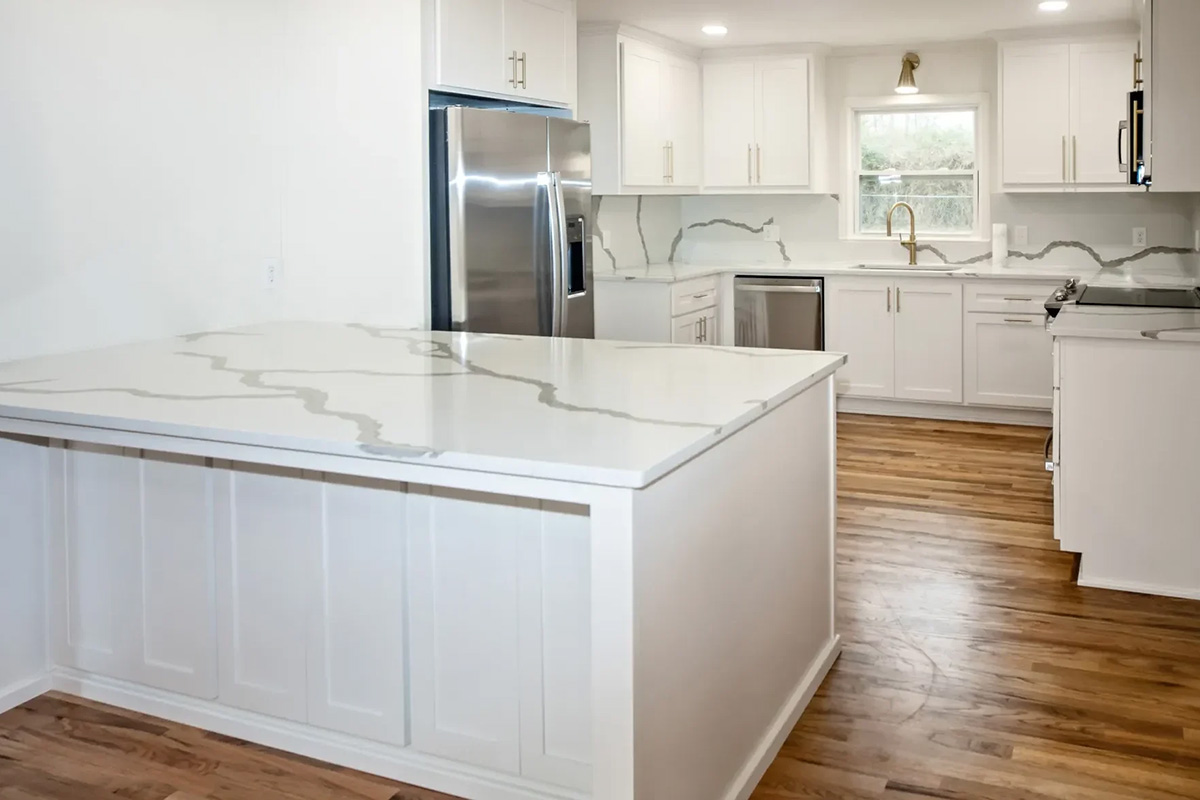 Beautiful white kitchen cabinets and marble countertop