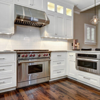 Luxury kitchen with white resurfaced cabinets